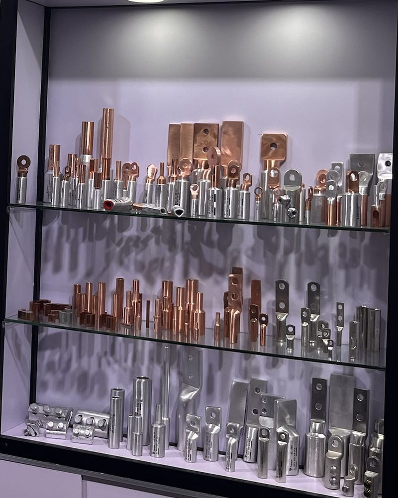 Copper and aluminium cable lugs on display shelves